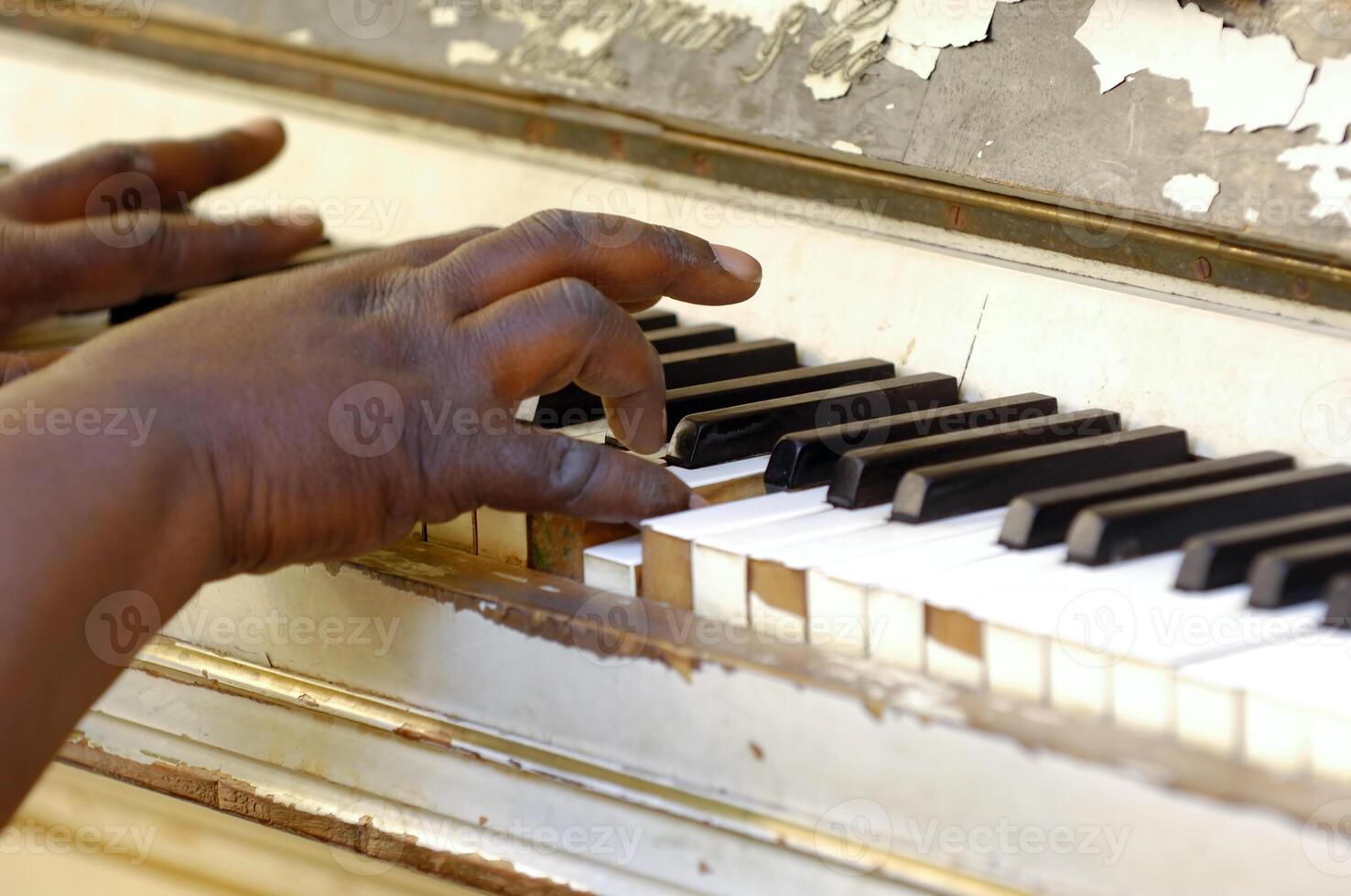 Piano and hands playing photo