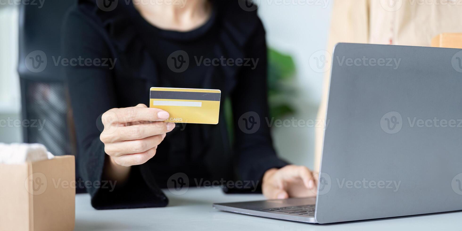 Home Shopper Using Credit Card for Online Purchase on Laptop photo