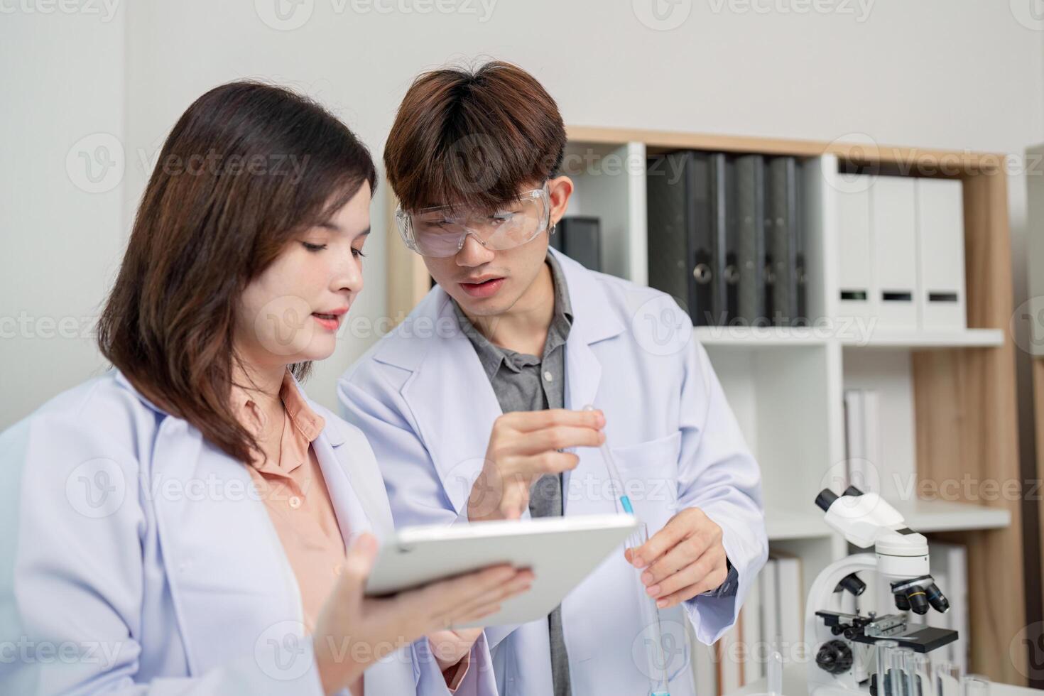 Collaborative Scientists Discussing Experiment Data for Research Outcomes photo