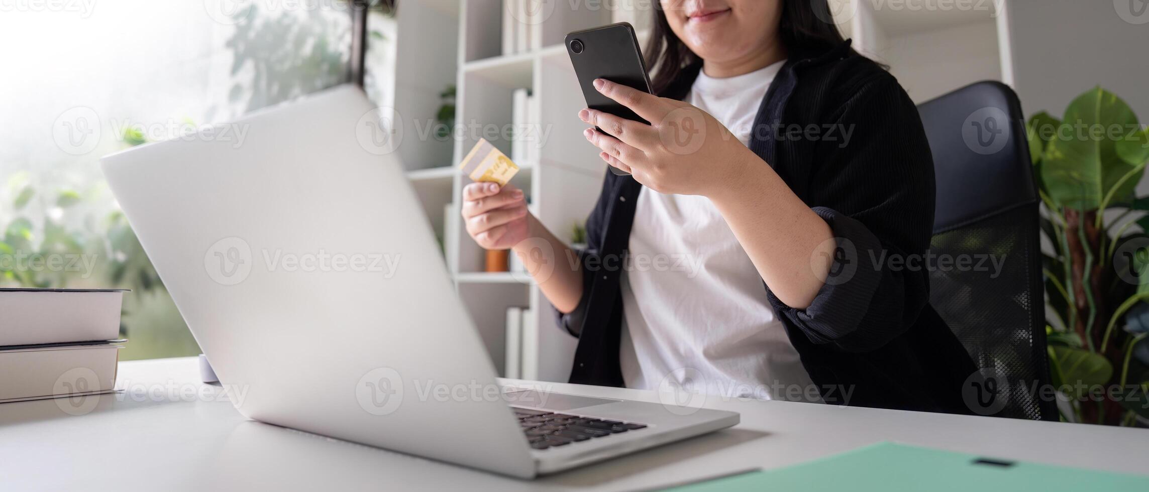 Consumer Using Smartphone and Laptop for Secure Online Shopping photo