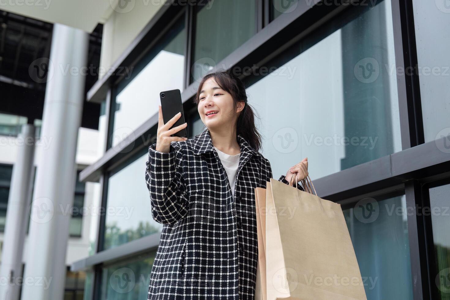 Joyful Shopper Celebrates Black Friday Deals with Smartphone photo