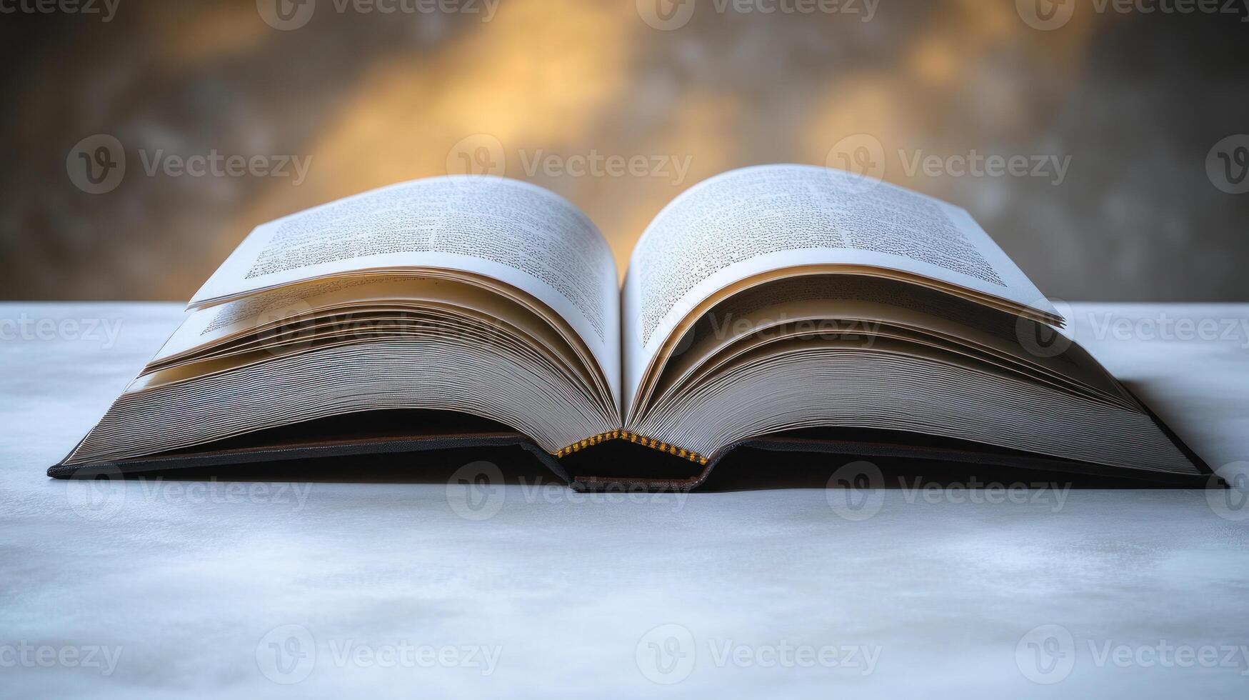 A beautifully opened book reveals its pages, inviting readers to explore its content photo