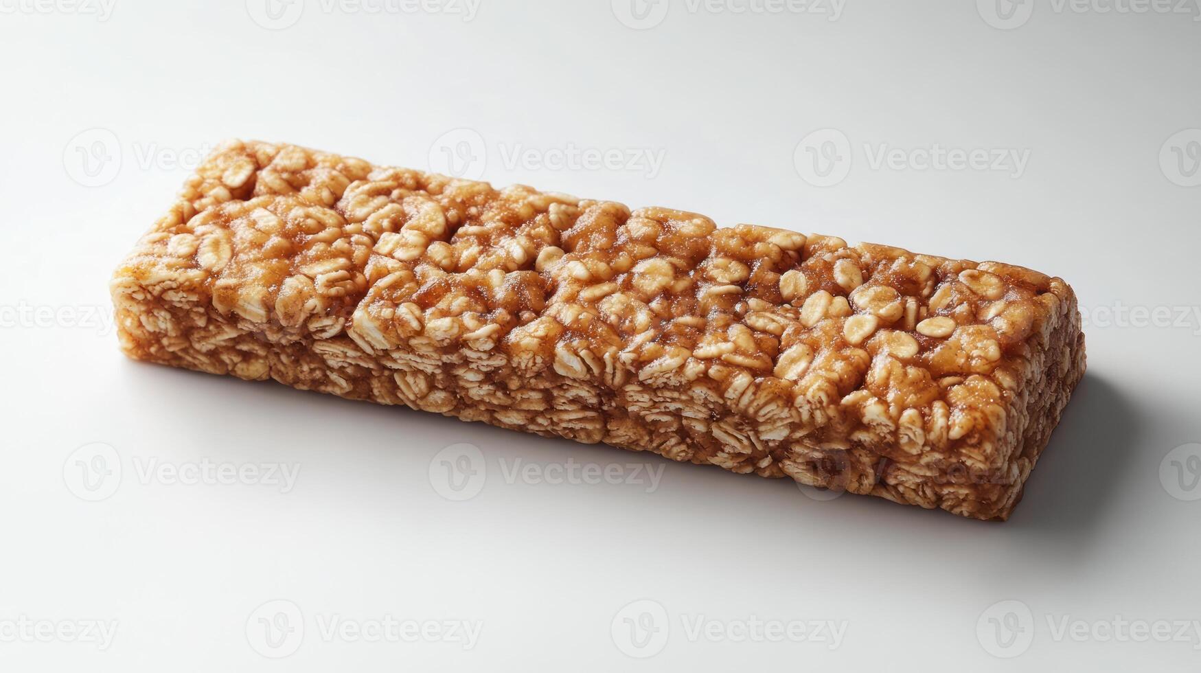 A chewy snack bar crafted from oats and honey rests elegantly on a clean surface photo
