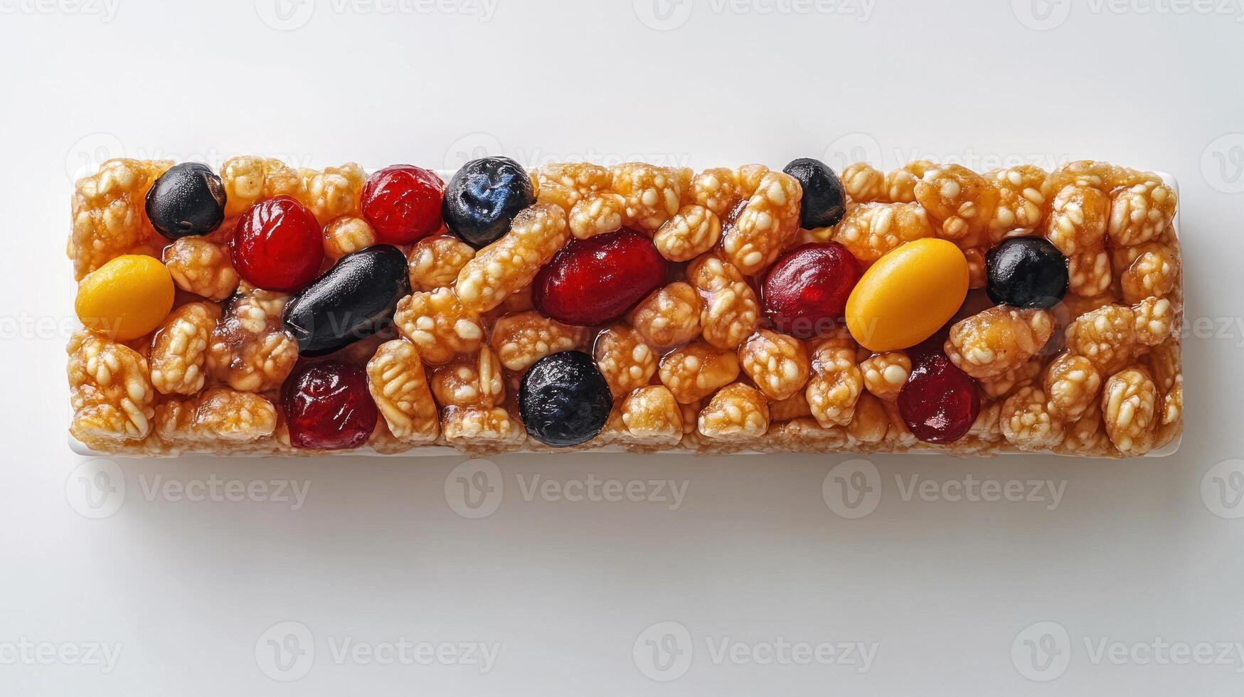 A colorful snack bar features a blend of nuts, fruit, and a crispy coating photo