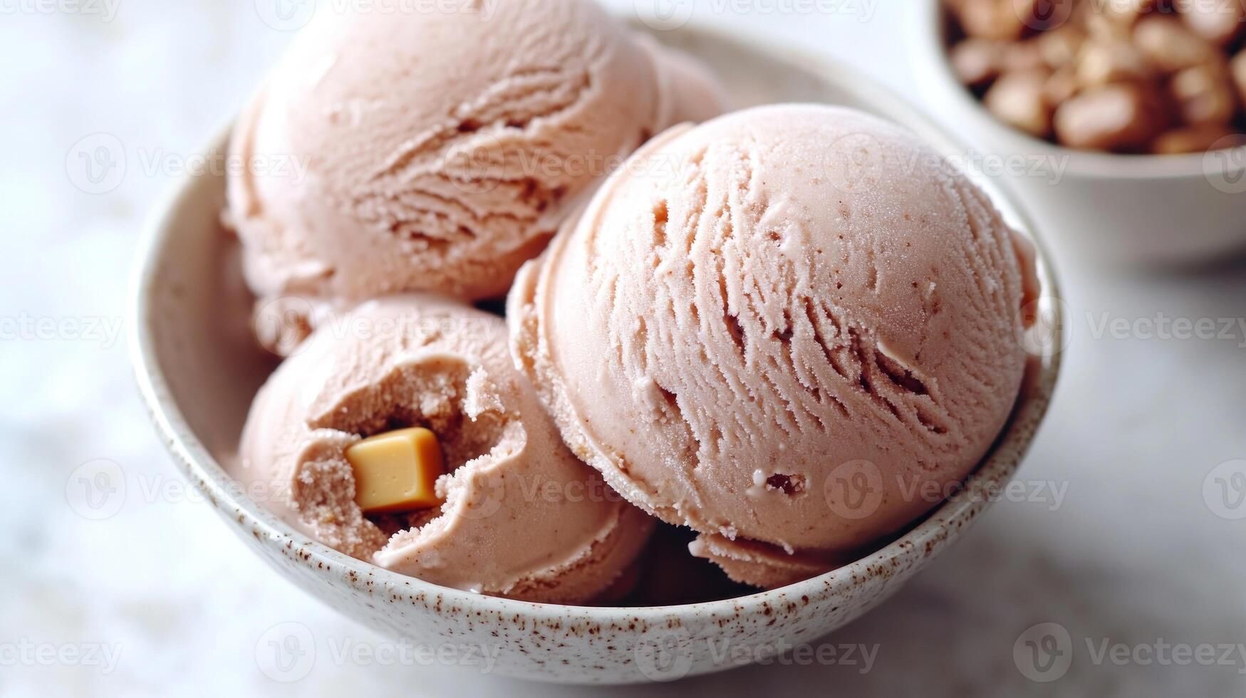 Enjoying delightful strawberry ice cream with gooey caramel hidden within photo