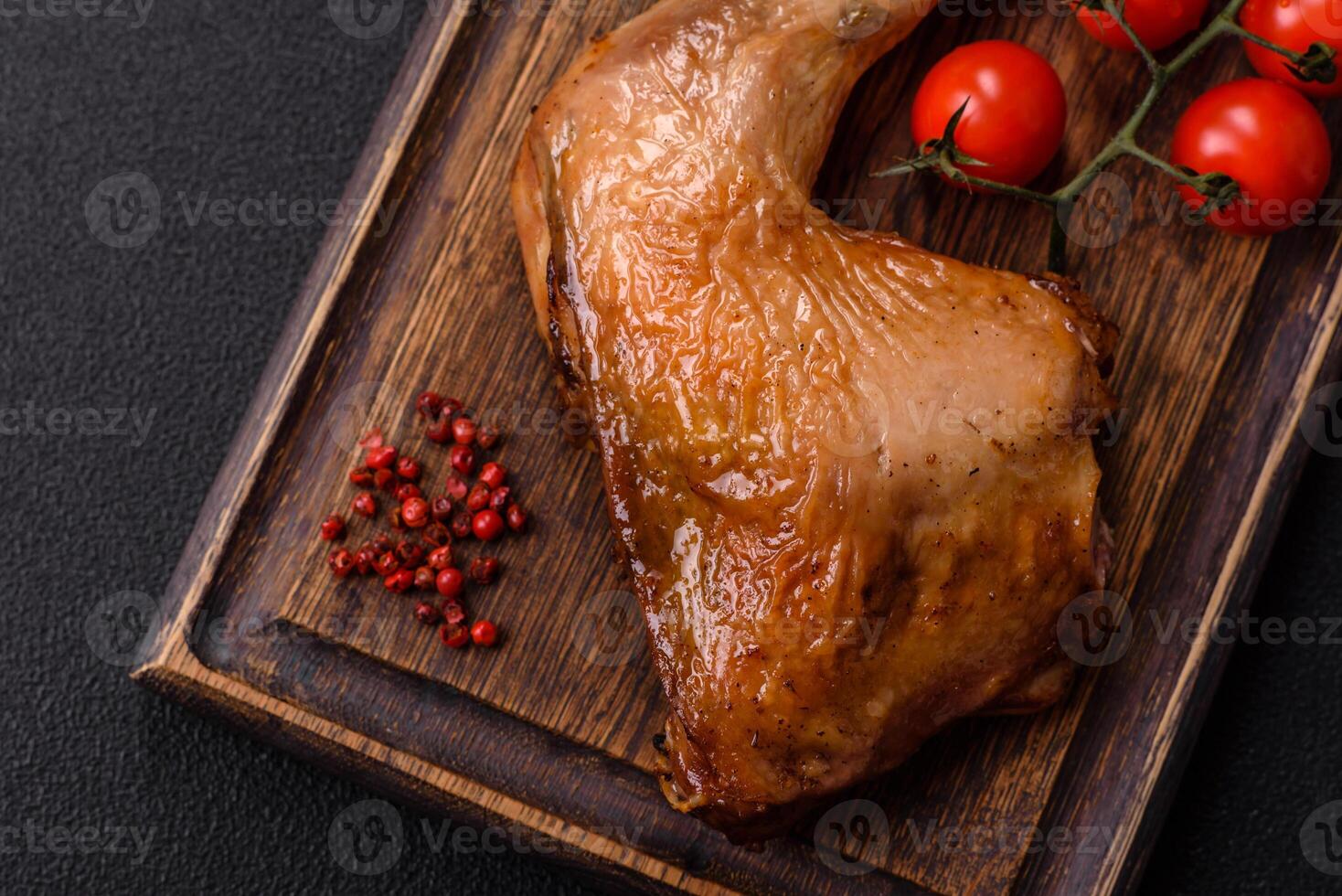 Delicious grilled chicken leg or quarter with salt and spices photo