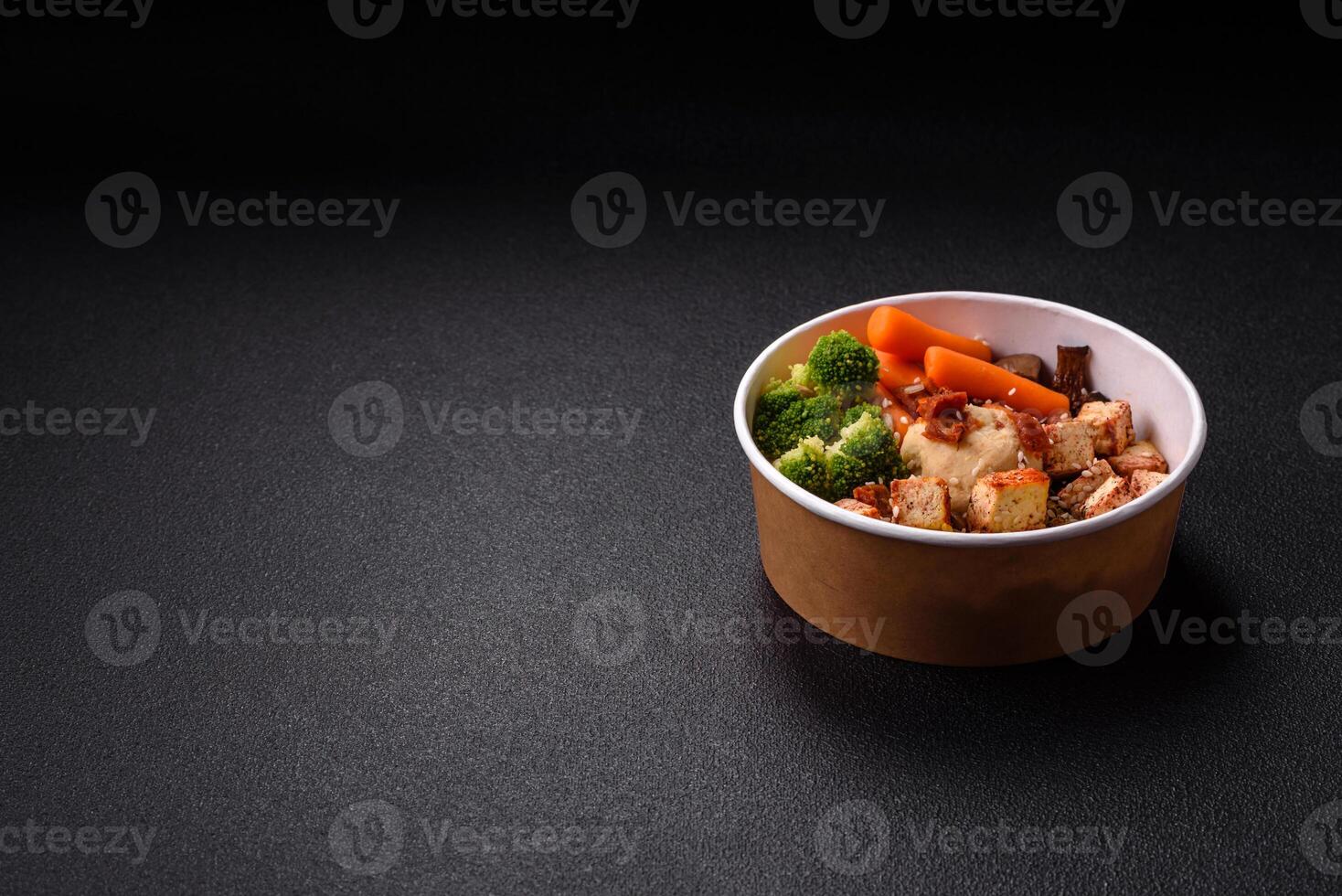 Colorful vegan vegetarian dish consists of tofu, broccoli, quinoa, mushrooms photo