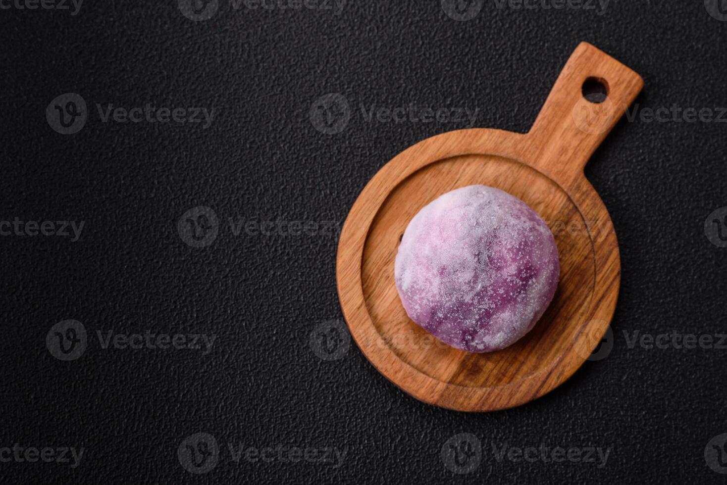 Delicious colorful asian mochi sweets with rice dough shell and fruit filling photo