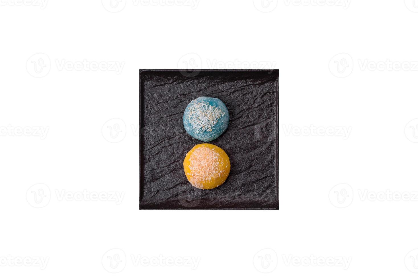 Delicious colorful asian mochi sweets with rice dough shell and fruit filling photo