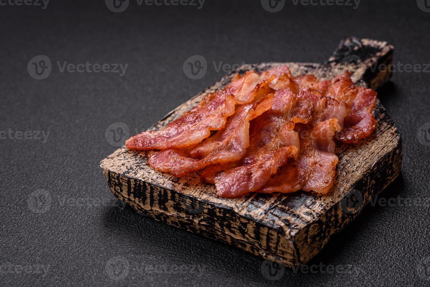 Delicious crispy bacon grilled with salt and spices photo