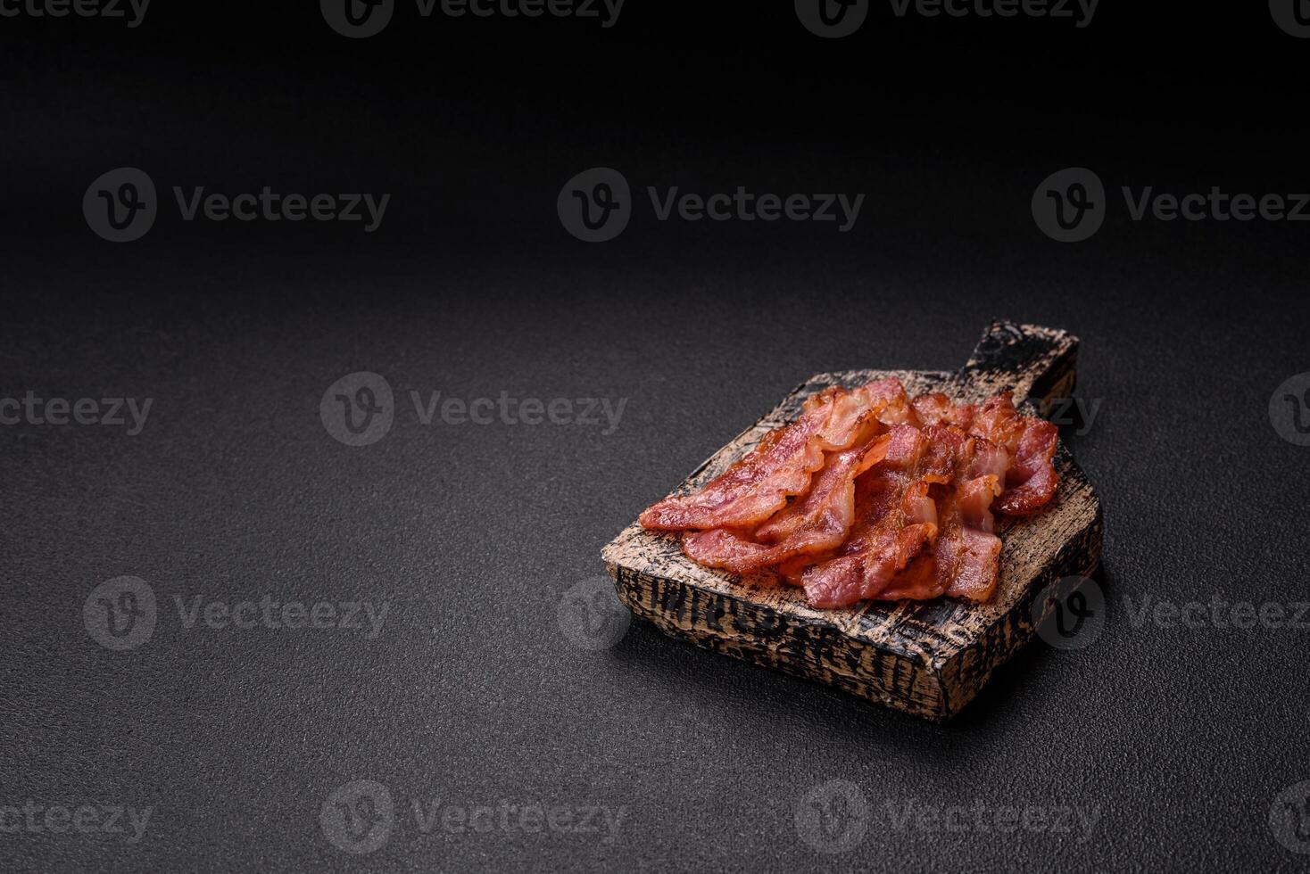 Delicious crispy bacon grilled with salt and spices photo