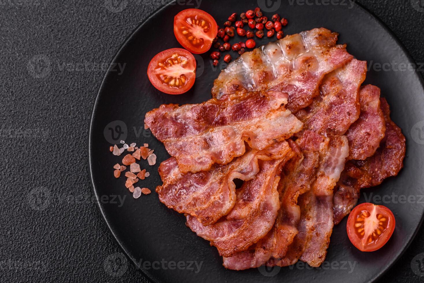 Delicious crispy bacon grilled with salt and spices photo