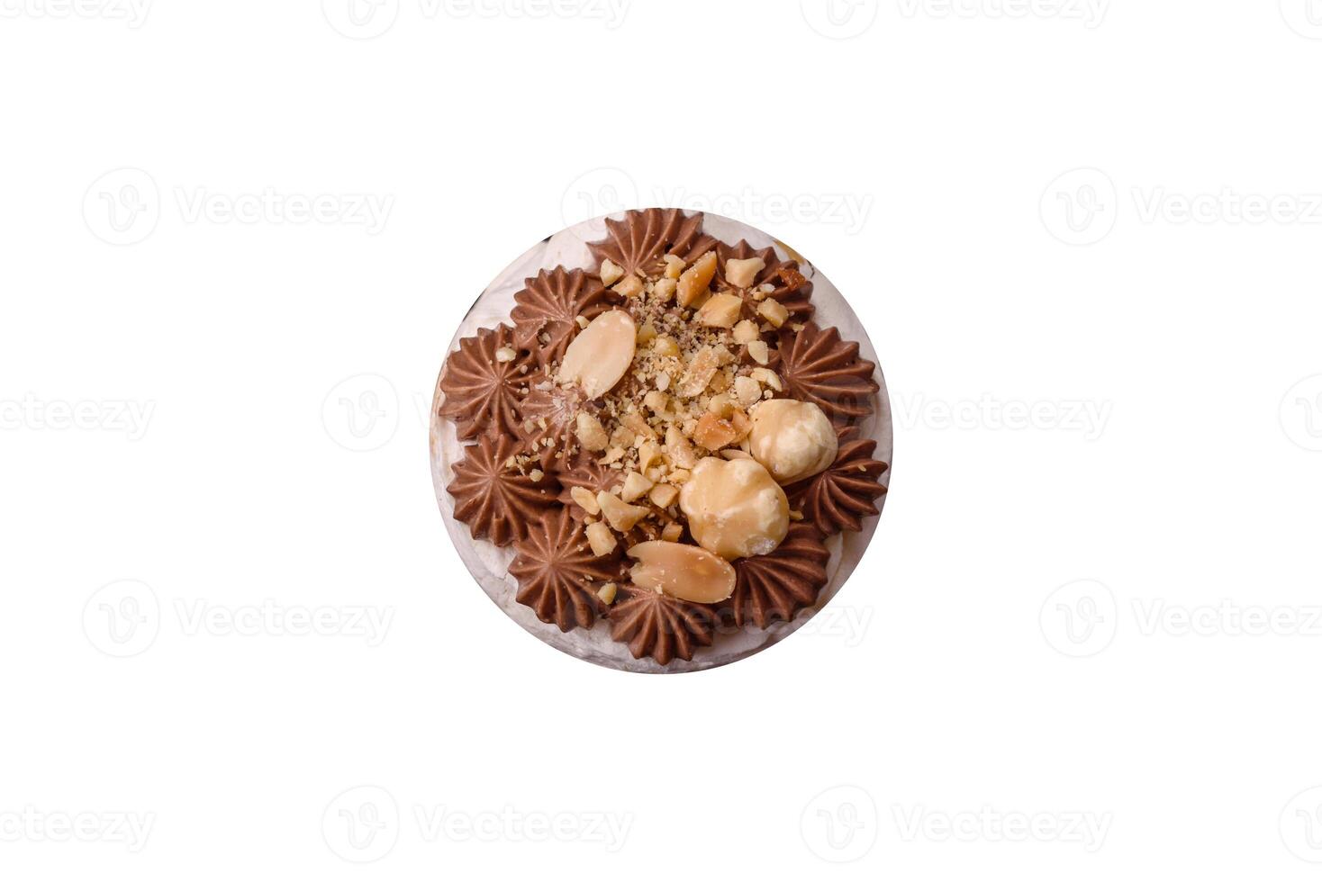 Sweet puff tart with meringue, cream and nuts photo