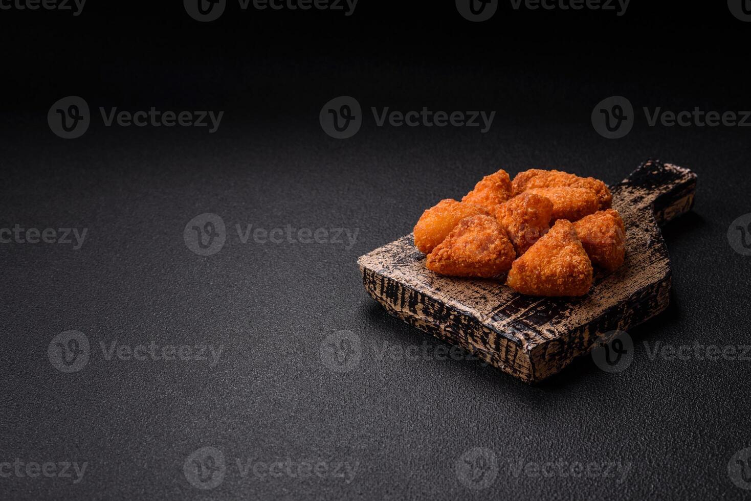 Brie cheese or camembert fries in breading, fast food, takeaway photo