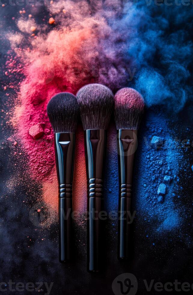 Artistic arrangement of colorful brushes. Three makeup brushes are positioned strategically with vibrant colored powders scattered around them, creating an artistic display. photo