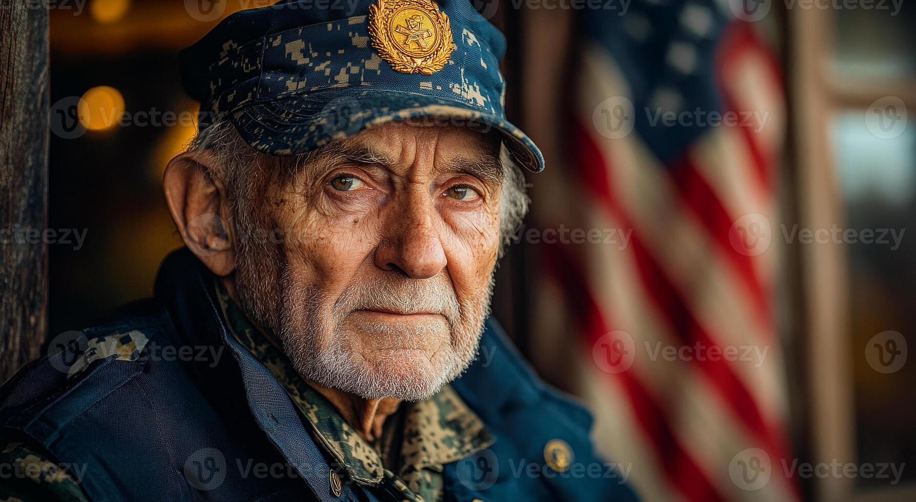 Veteran reflects on service by flag. An older veteran sits pensively, gazing into the distance, surrounded by reminders of past military service and patriotism. photo