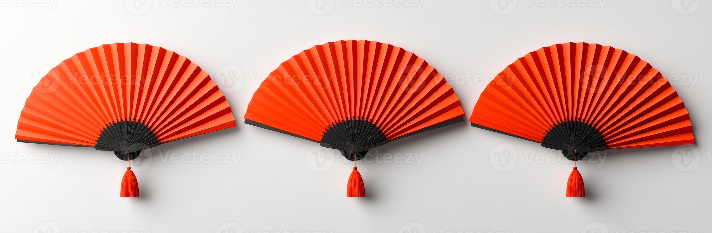 Red folding fans on wall display. Three beautifully crafted red folding fans hang elegantly on a white wall, showcasing their intricate design and vibrant color. photo
