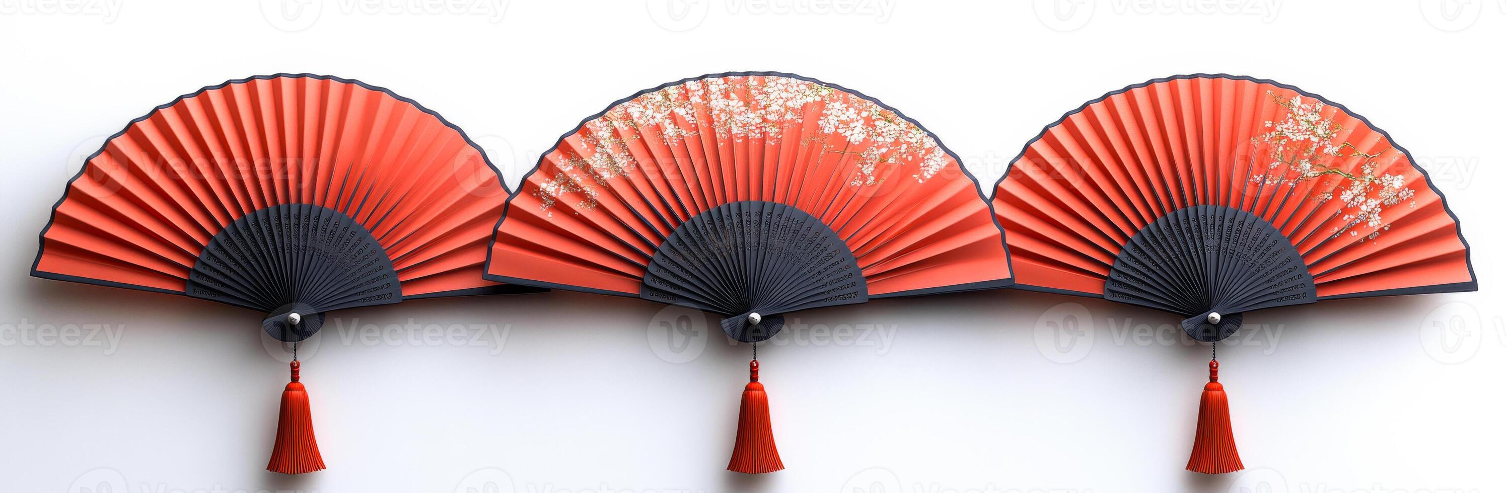 Elegant decorative fans arranged in a row. A group of three red decorative fans showcases intricate designs, featuring black accents and tassels, creating a stunning display. photo