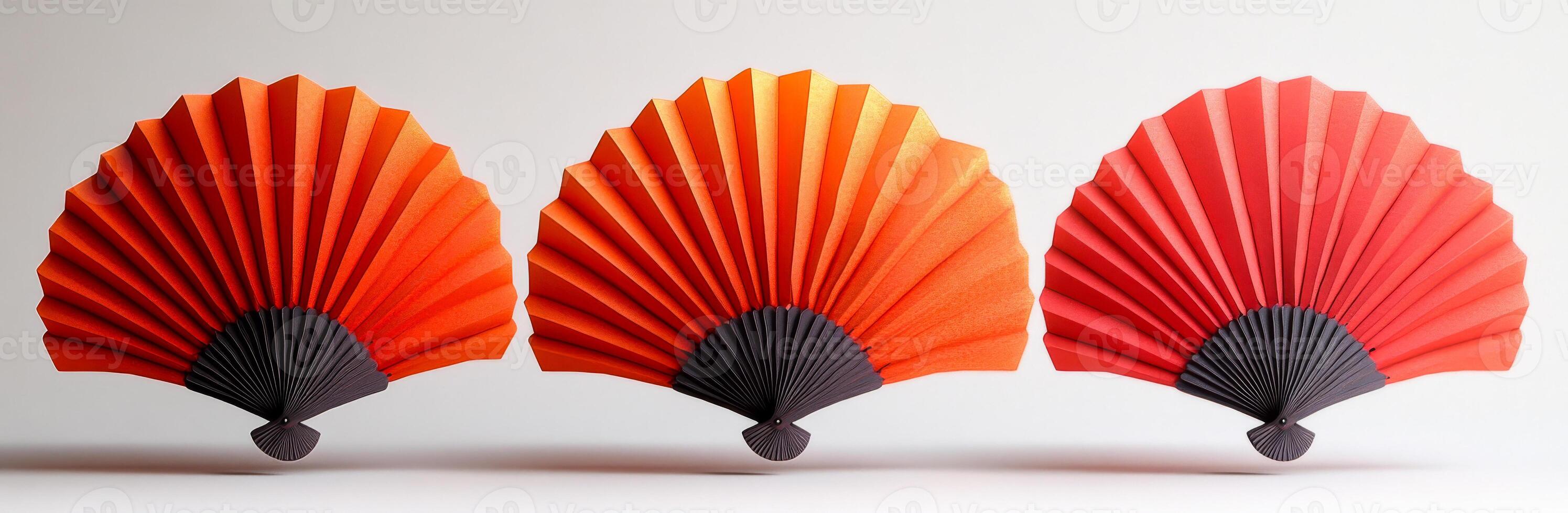 Elegant traditional paper fans arranged in a row. Three beautifully crafted paper fans in shades of red and black are elegantly arranged, showcasing their intricate design and craftsmanship. photo