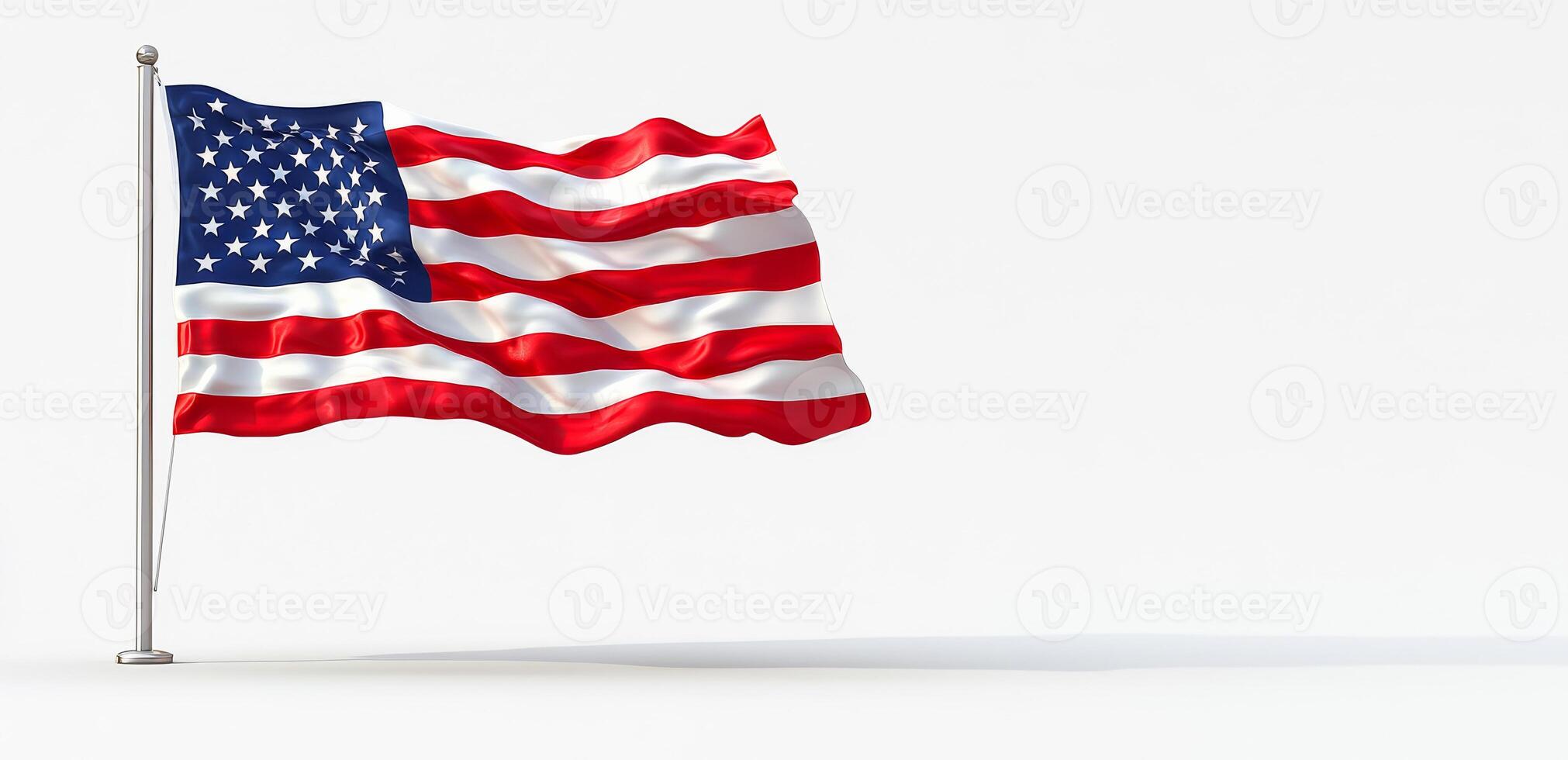 A large American flag is blowing in the wind. The flag is red, white, and blue and is attached to a pole. The flag is waving in the wind, creating a sense of freedom and patriotism photo