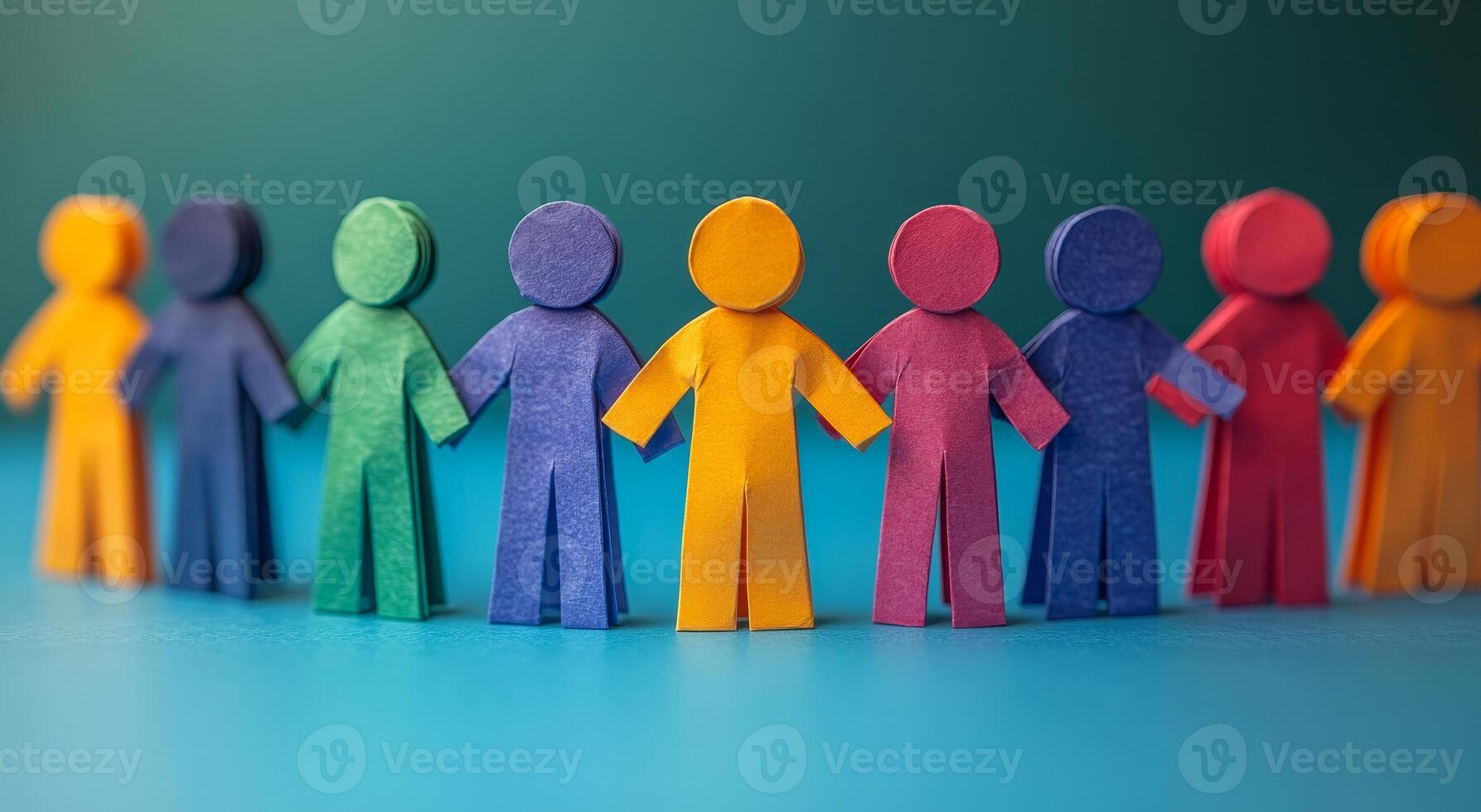 A group of people are holding hands in a circle. The people are of different colors and sizes. Concept of unity and togetherness photo