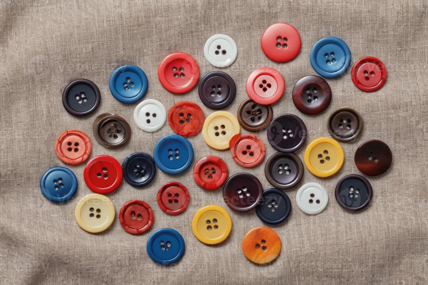 flat lay colorful buttons on cloth photo