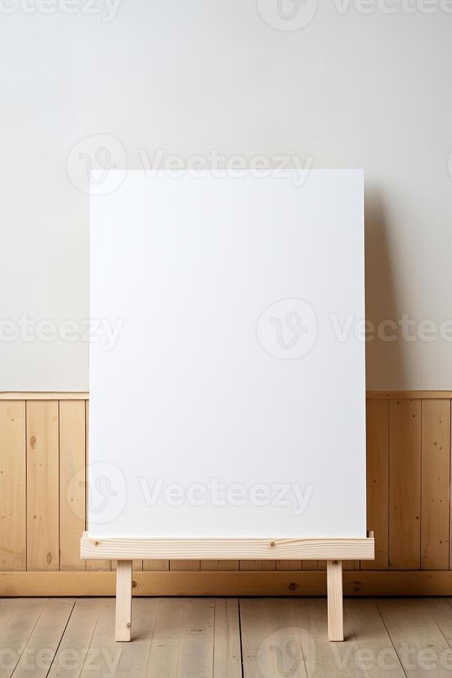 Blank canvas on easel in a room with wooden walls photo