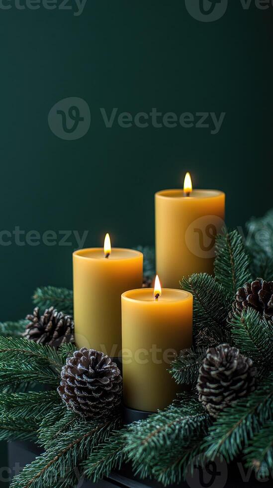Three lit candles creating a warm christmas ambiance photo