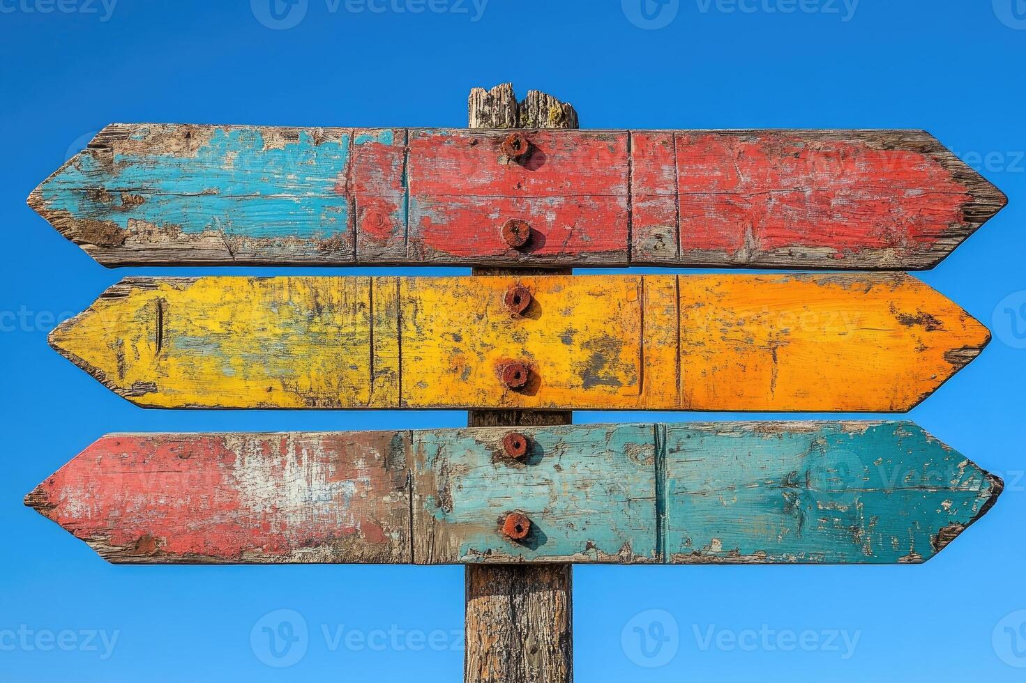 Colorful empty wooden directional signs pointing in different directions photo