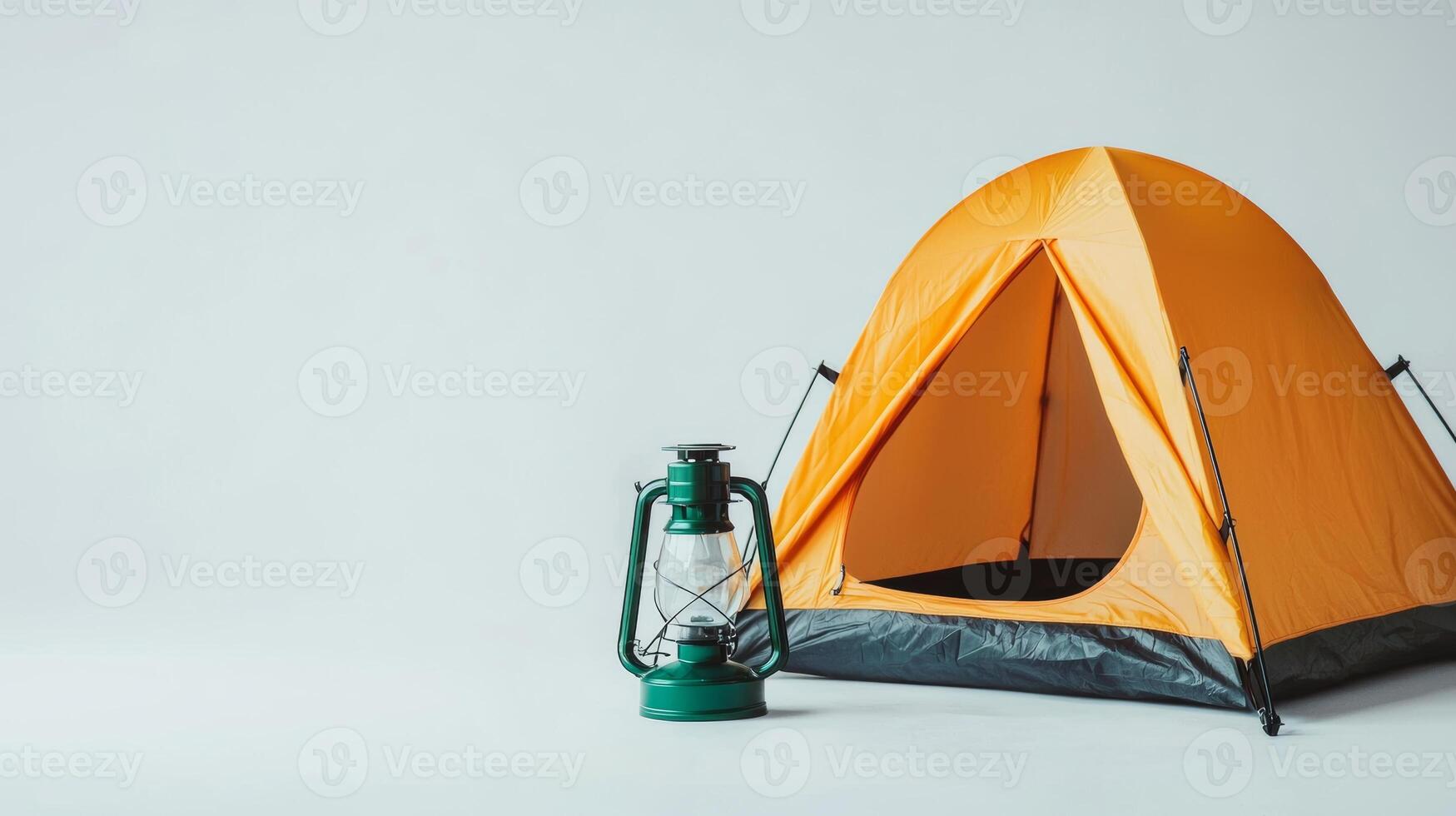 Bright Orange Camping Tent with Lantern - Essential Adventure Equipment for Camping and Climbing Enthusiasts photo