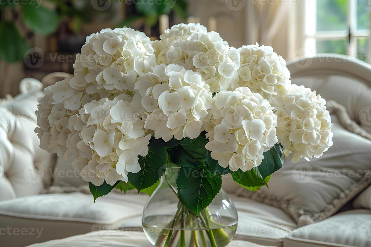 Elegant White Hydrangea Bouquet in Glass Vase for Interior Decor and Floral Arrangements photo