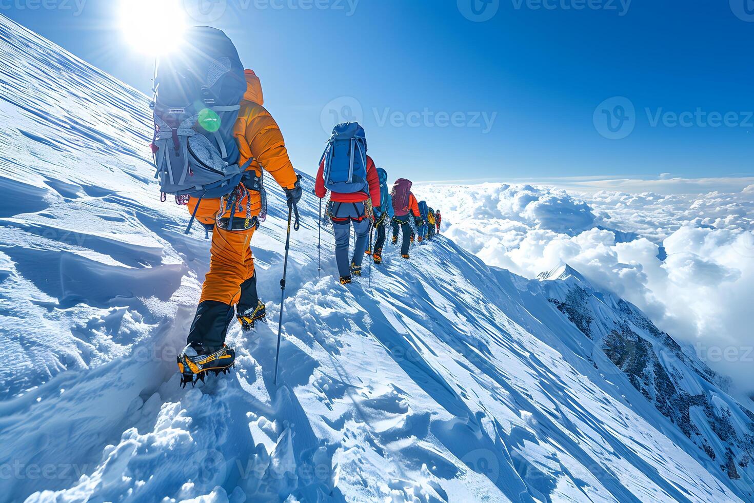 Adventurous Winter Mountaineering Expedition on Snowy Peak under Bright Sunlight photo