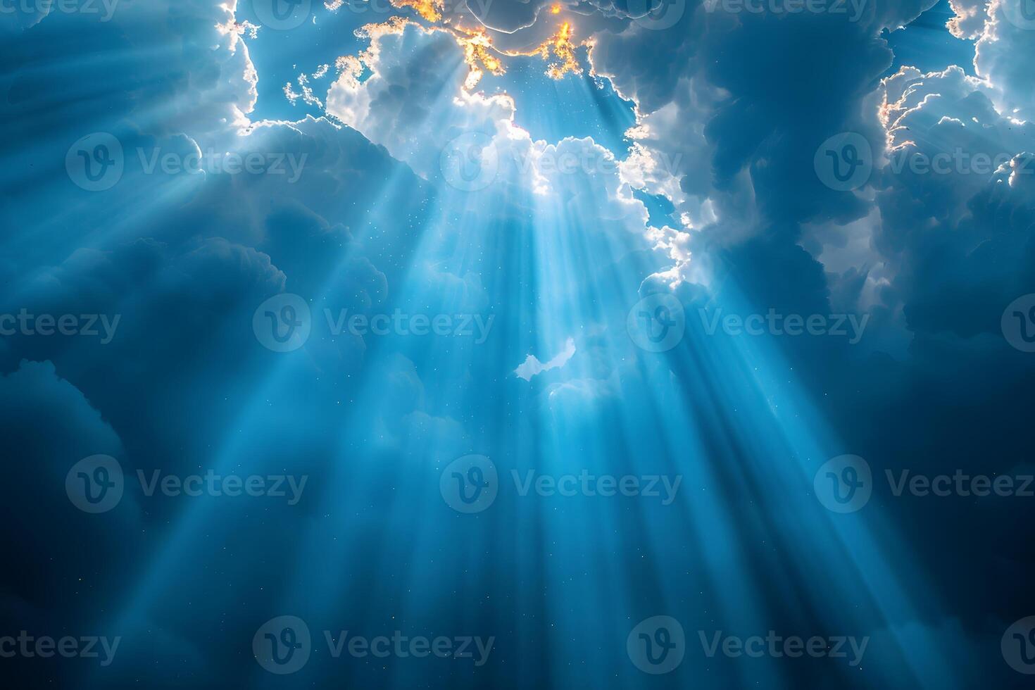 Celestial Sunbeams Filtering Through Majestic Clouds in a Serene Sky photo