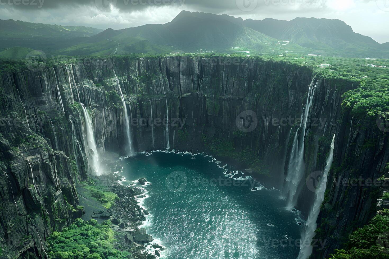 Majestic Waterfalls Cascading into Pristine Canyon Amidst Lush Green Mountains photo