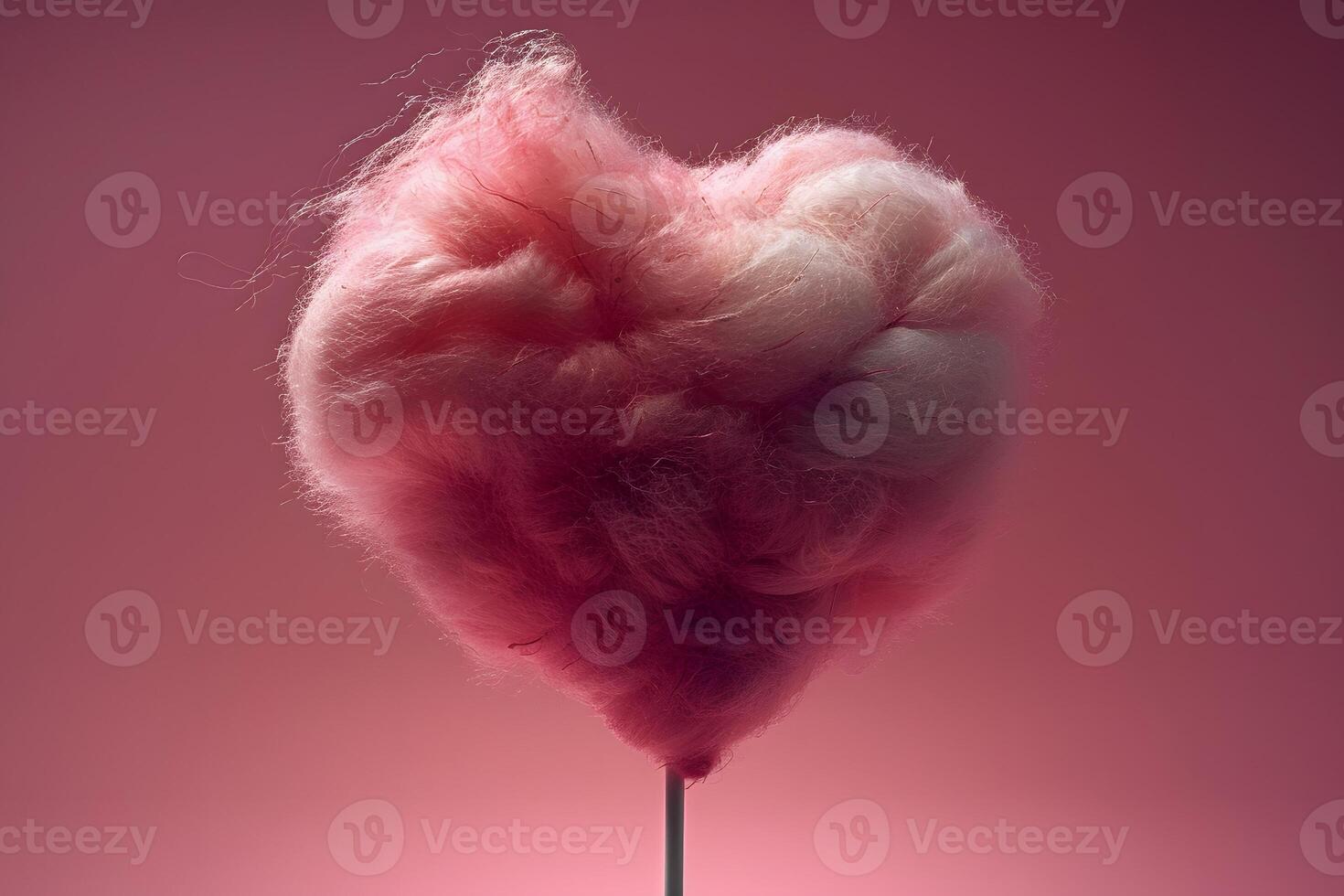 Heart-Shaped Cotton Candy on Stick Against Soft Pink Gradient Background photo