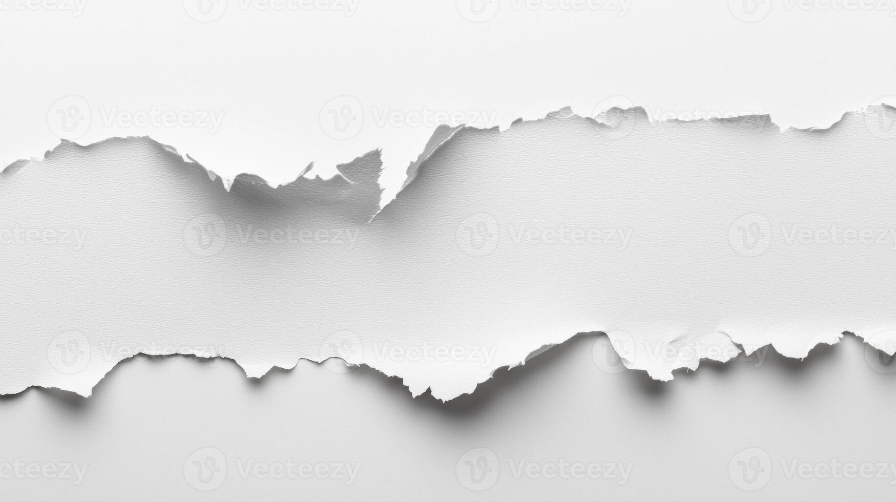 stark white paper features a clean horizontal tear creating a perfect space for text or design elements. The minimalist shadows add depth to the simple beauty. photo