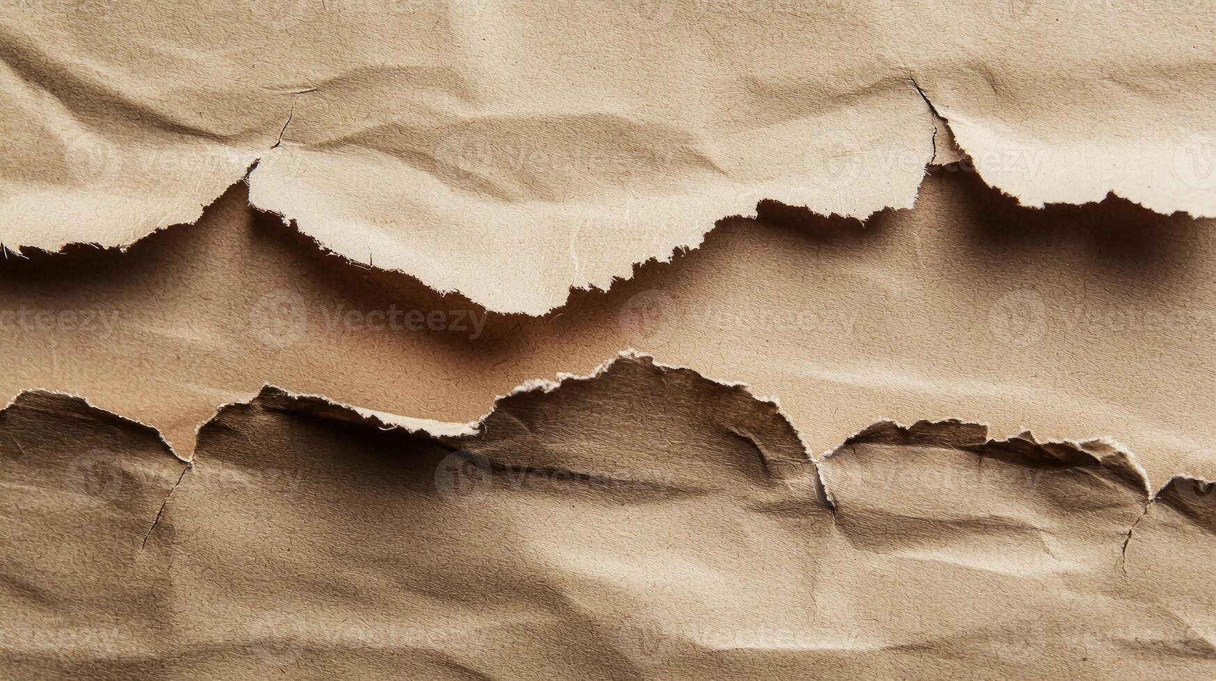 close up reveals intricate details of torn paper edges highlighting the rich textures and shadows that create a visually engaging backdrop for design projects. photo