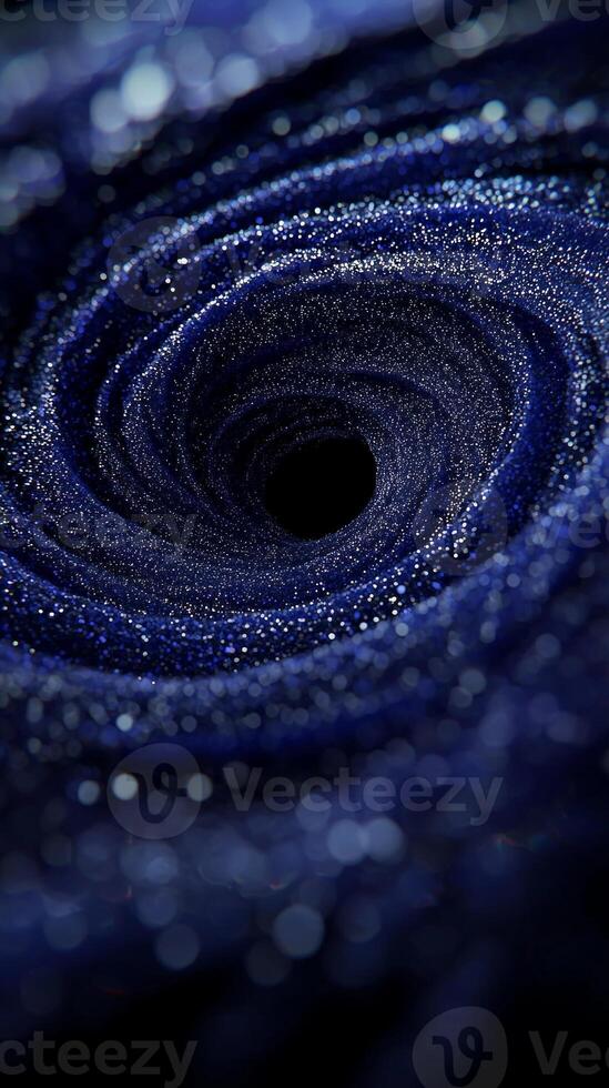 Purple particles unite to create a stunning vortex that glows intensely at the center, swirling with cosmic energy against a stark black background, showcasing captivating motion. photo