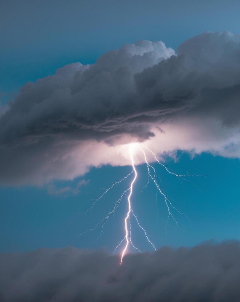 Lightning bolt striking through the clouds photo