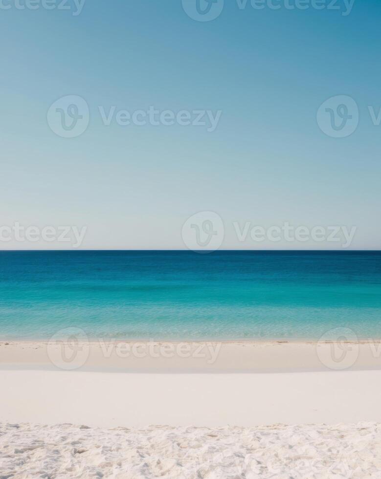 A beach with clear water and white sand photo