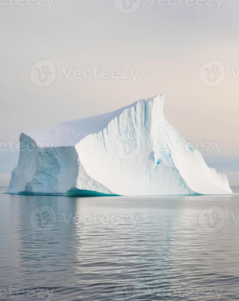 Iceberg in the ocean with a large iceberg floating in the water photo