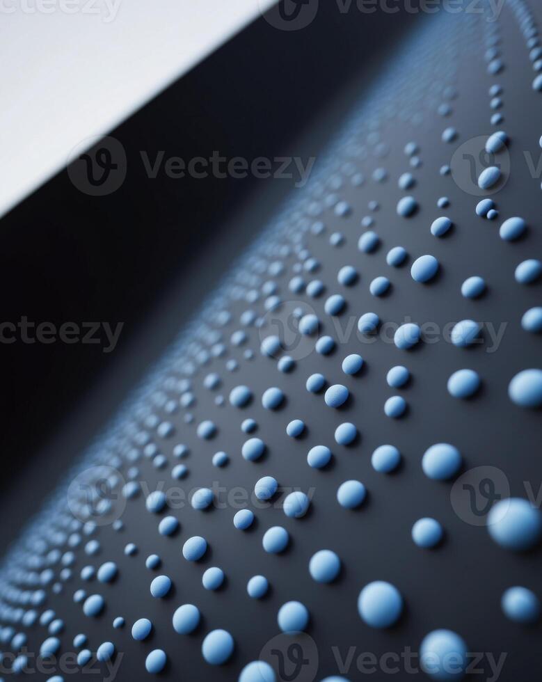 A close up of a black surface with blue bubbles photo