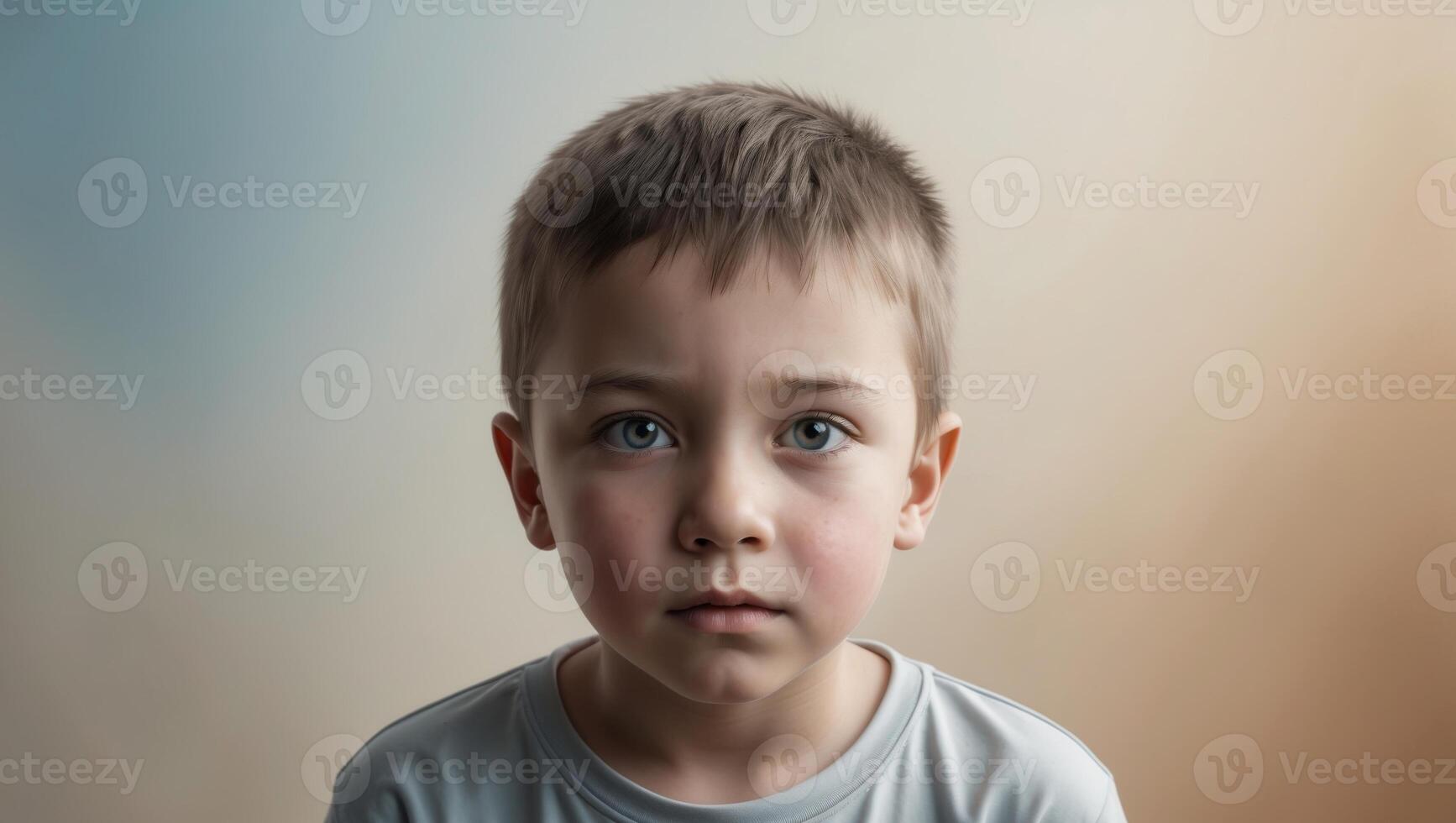 A young boy with a sad expression photo
