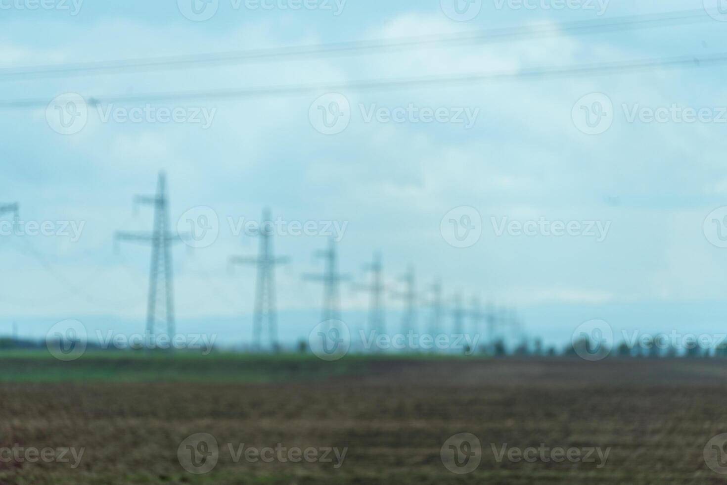 High voltage towers with sky background. Power line support with wires for electricity transmission. High voltage grid tower with wire cable at distribution station. Energy industry, energy saving photo