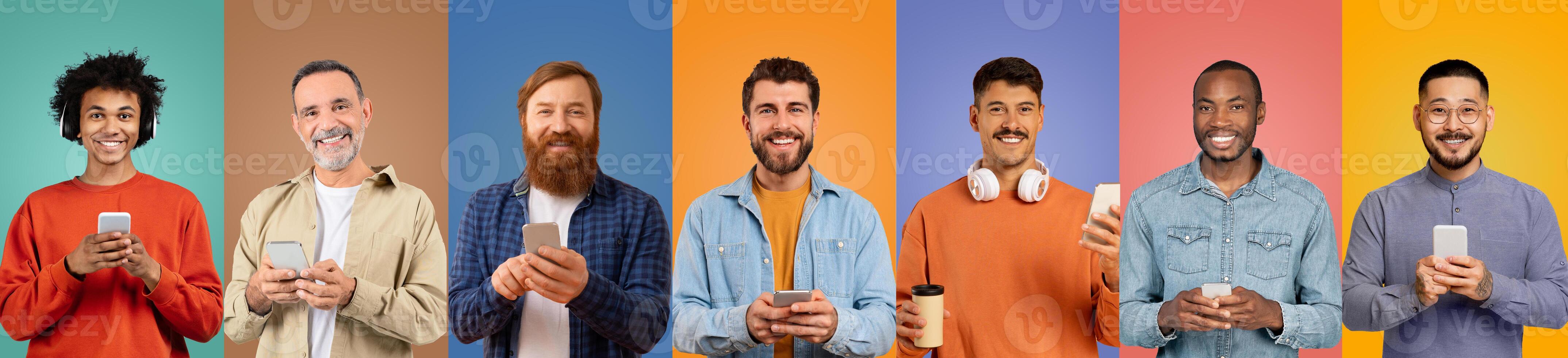 A diverse group of seven men stands in front of brightly colored backgrounds, each engaged with their smartphones photo