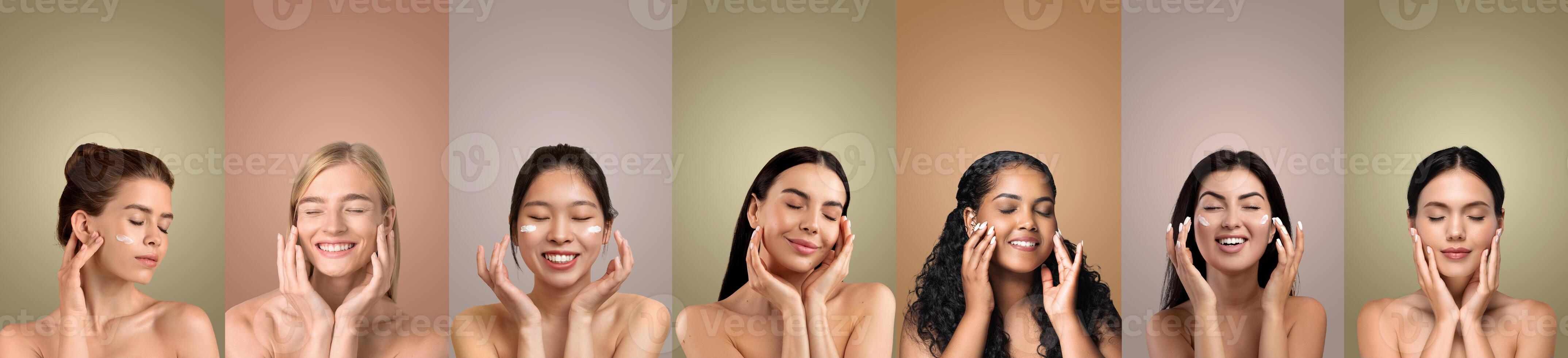 Seven women with different skin tones and hair colors are smiling as they apply a creamy product to their faces in front of seven solid color backgrounds. Each woman has her hands on her cheeks photo