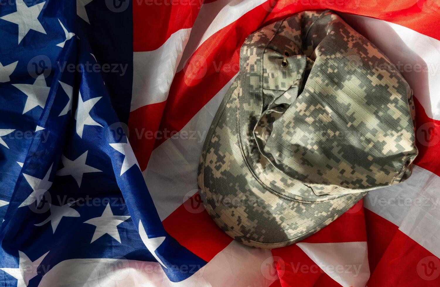 US Army helmet and dog tag on US flag background photo