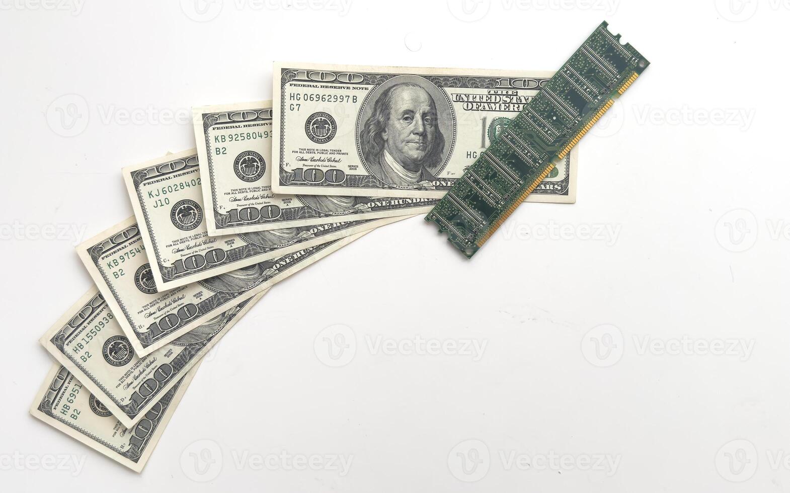 Computer CPU and memory chips on US dollar banknotes background. The high cost of microelectronics concept photo