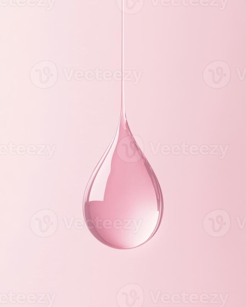 A single pink droplet of liquid, gracefully hanging against a muted, soft background photo