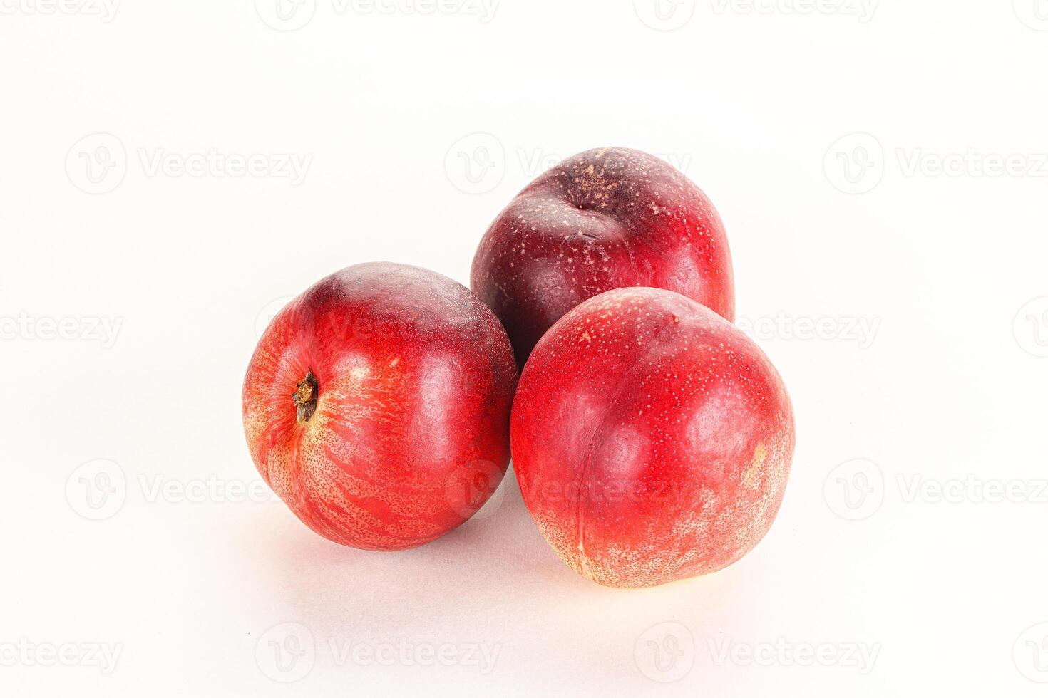 Ripe sweet juicy nectarines heap photo